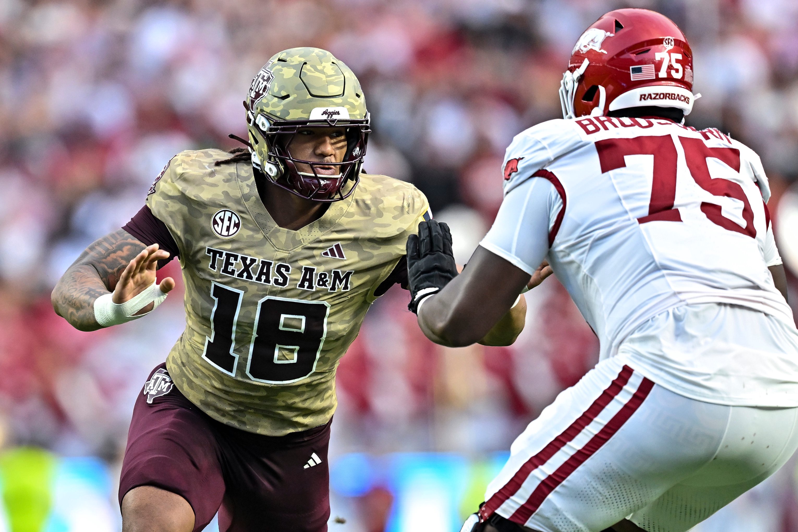 Oct 3, 2026; College Station, Texas, USA; Texas A&amp;M Aggies defensive end T.J. Searcy (18) defends in coverage during the first half against the Arkansas Razorbacks at Kyle Field. Mandatory Credit: Maria Lysaker-Imagn Images
