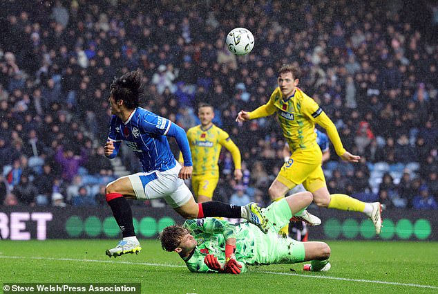 Kim Min-su (left) has an attempt saved by St Johnstone goalkeeper Toby Steward