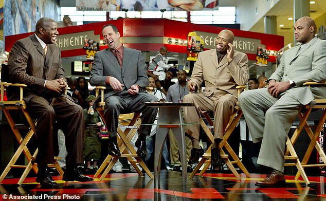 FILE - "Inside the NBA" hosts, from left, Earvin "Magic" Johnson, Ernie Johnson Jr., Kenny Smith, and Charles Barkley prepare for their live broadcast during TNT's NBA doubleheader coverage on Feb. 10, 2004, in the Compton section of Los Angeles. (AP Photo/Ric Francis, File)