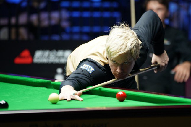 WUHAN, CHINA - AUGUST 24: Neil Robertson of Australia plays a shot in the second round match against Ben Mertens of Belgium on day 2 of Wuhan Open 2026 at the Optics Valley Gymnasium of Huazhong University of Science and Technology on August 24, 2026 in Wuhan, Hubei Province of China. (Photo by Tai Chengzhe/VCG via Getty Images)