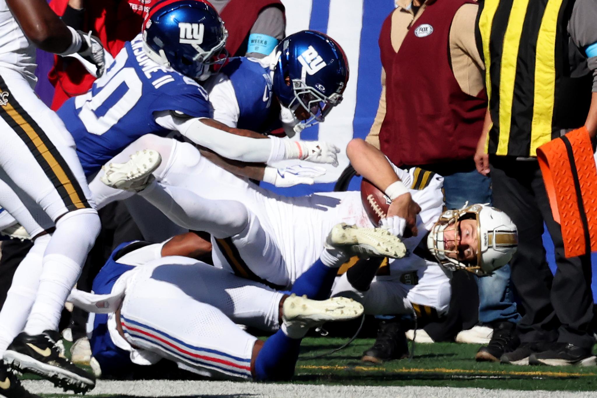 Quarterback Tyler Shough #6 of the New Orleans Saints is sacked