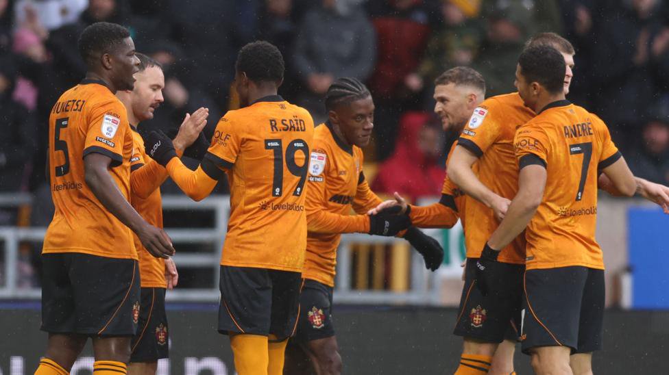Wolves players celebrate taking the lead over Watford