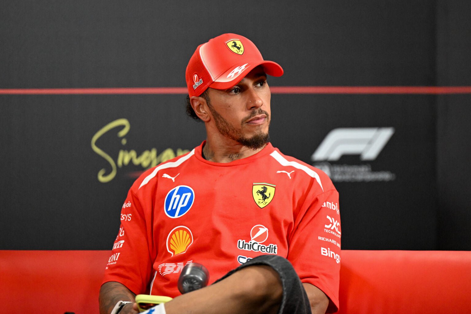 Lewis Hamilton of Ferrari sits in a press conference