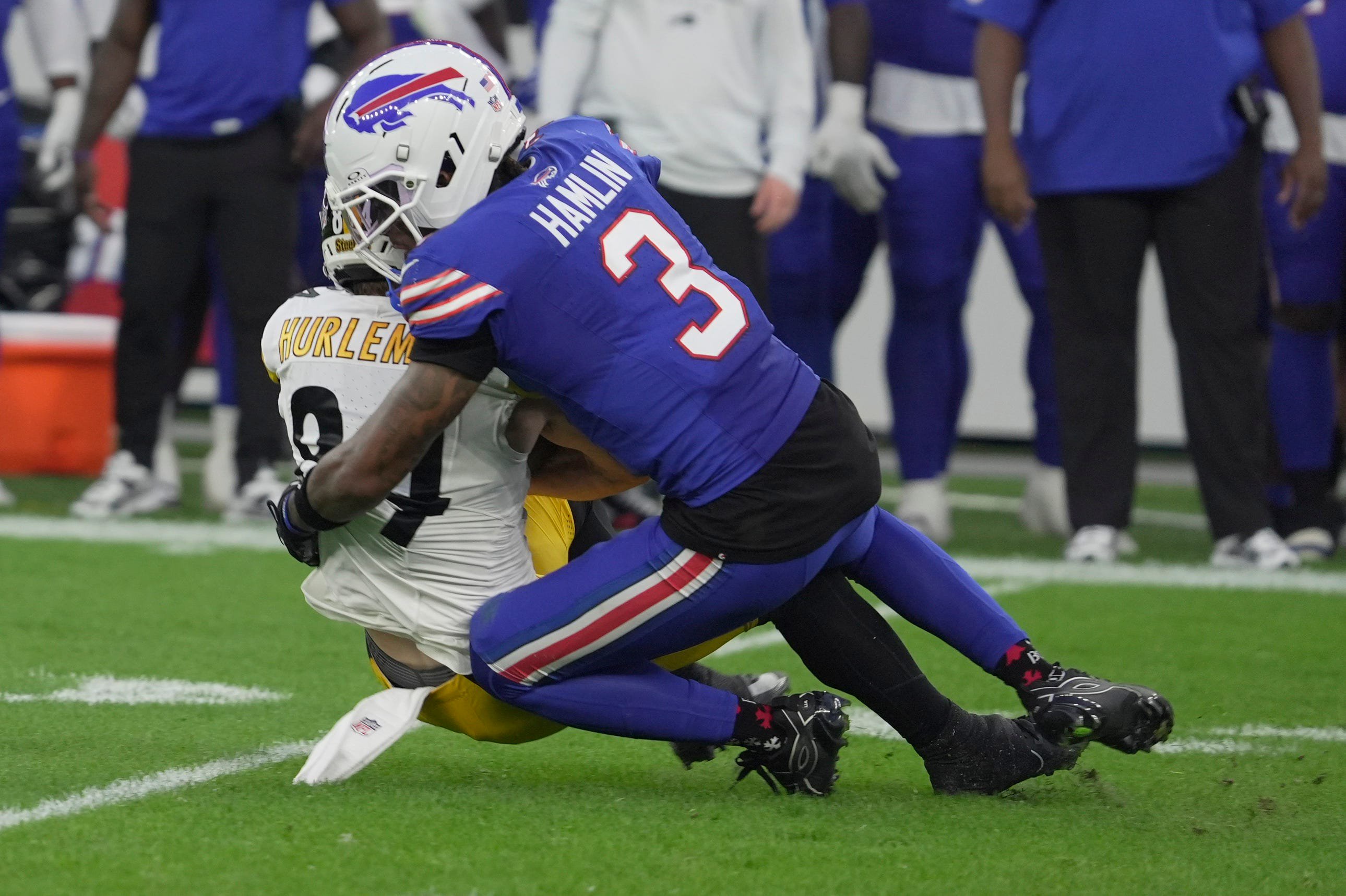Buffalo Bills defensive back Damar Hamlin tackles Pittsburgh Steelers running back Max Hurleman during first half action of the Bills preseason game against the Pittsburgh Steelers at Highmark Stadium on Aug. 27, 2026.