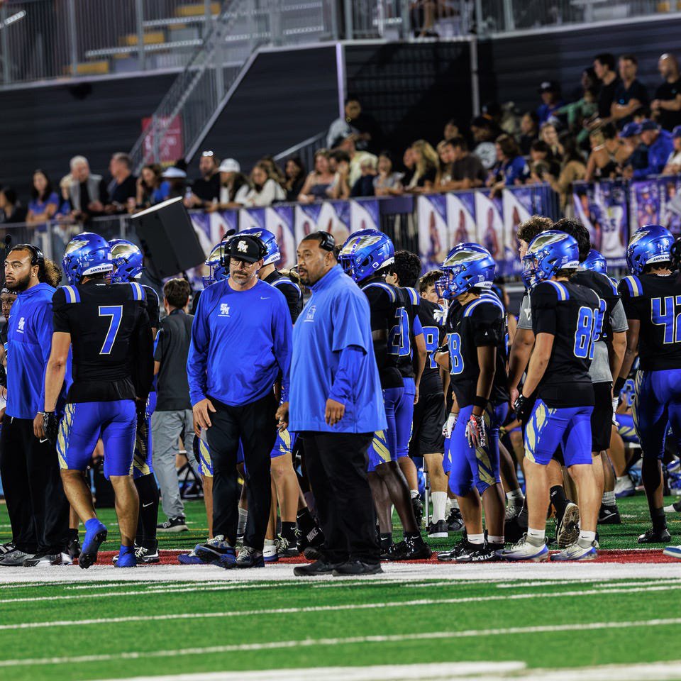 Santa Margarita defense coordinator Steve Fifita (center) scans the field during a game in 2026.