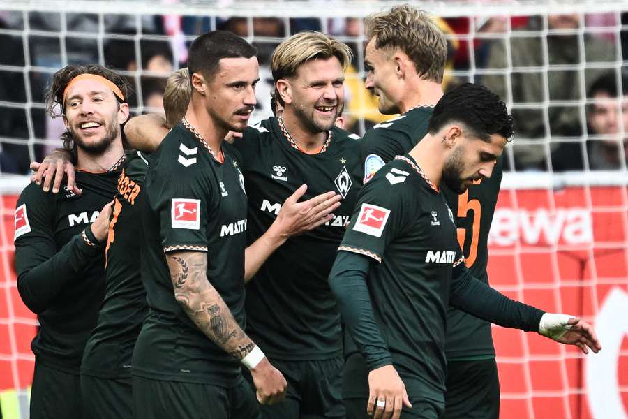 Niclas Fullkrug celebrates with teammates