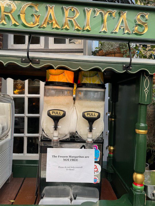 Story from Jam Press (Angry Pub Owner) Pictured: The frozen Margaritas machine at the pub.  Pub owner 'baffled' after customer refuses to pay for ??12 drinks because 'she thought it was cheap' A pub owner has been named as ???angry little man???  by a customer who left a scathing review because they had to pay for their drink.  Heath Ball, owner of the Red Lion & Sun pub based in Highgate, has been left out?  after helping a customer themselves to the frozen cocktail machine center???  free.  The 50-year-old was later tipped off by the punter in question, who took to TripAdvisor to share a three-star review.  The anonymous guest sat outside and saw the drinks machine, assuming it was ???free???  and proceeded to pour himself.  Heath, who had previously been beaten by the press, is forced to place a sign on top of the machine to prevent anyone else from trying to score a free cocktail.  She was drinking all day and it was clearly advertised with signs on the prices of these drinks,???  he told NeedToKnow.co.uk.  If it was free, we'd have a queue around the block, it's just a stupid excuse.  That's the first time it happened, because no one has ever done this, because they know they are not free.  ???Why would I have a free margarita stand sitting here?  It's hard to make a lot of money right now, let alone give away alcohol for free.  ???  She got upset when I showed her the sign [and then she] she took a photo and posted it on her TripAdvisor.  I was angry, but I couldn't believe it.???  Read the review: ???[...] We then went to sit outside and there was a frozen margarita stand with a pouring machine with no one there to pour and no signs explaining that this is not a complimentary drink or where to pay so I just assumed it was clean glasses on the stand they were free.  I was then greeted by a rude man who demanded I pay for the drink when I explained I thought it was suggestive due to lack of signs and he said I wasn't