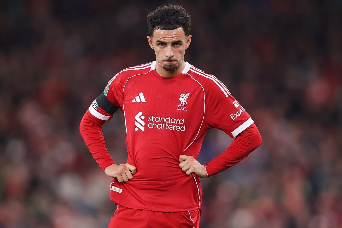 Curtis Jones puts his hands on his hips