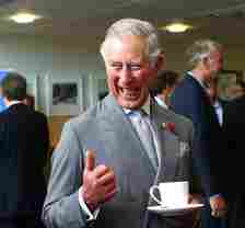 Then-Prince Charles drinking tea with locals during tour of Australia and New Zealand
