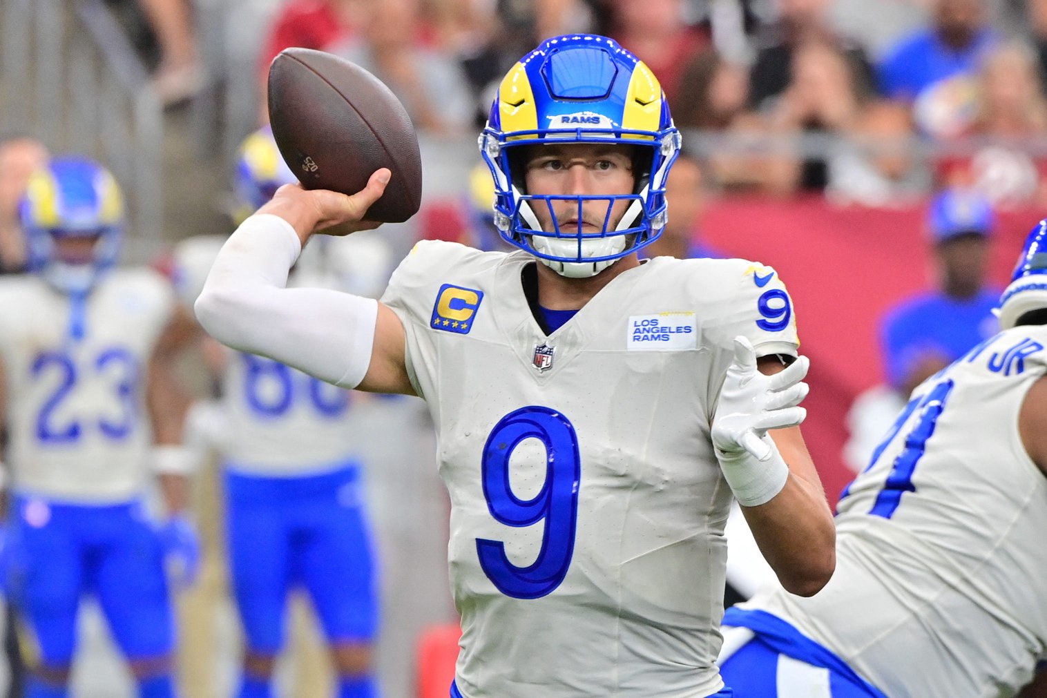 Sep 15, 2024; Glendale, Arizona, USA;  Los Angeles Rams quarterback Matthew Stafford (9) throws in the first half against the Arizona Cardinals at State Farm Stadium. Mandatory Credit: Matt Kartozian-Imagn Images