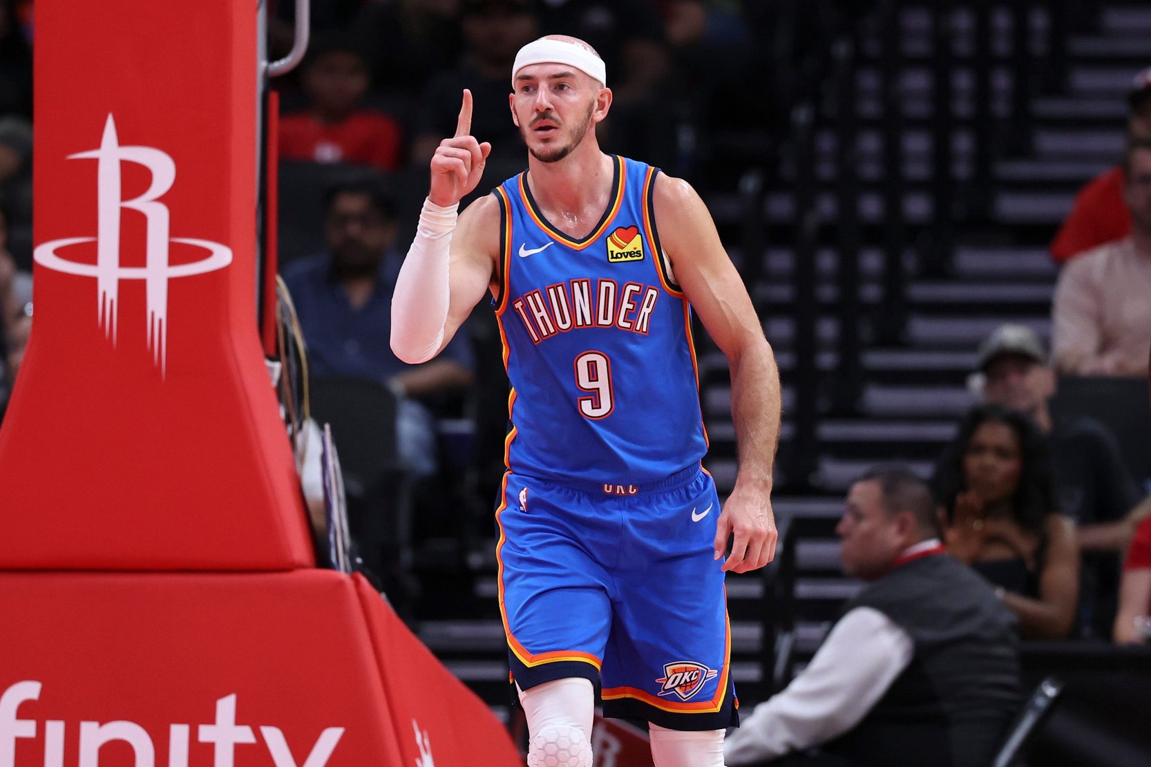 Oct 15, 2026; Houston, Texas, USA; Oklahoma City Thunder guard Alex Caruso (9) reacts after scoring a basket during the second quarter against the Houston Rockets at Toyota Center. Mandatory Credit: Troy Taormina-Imagn Images