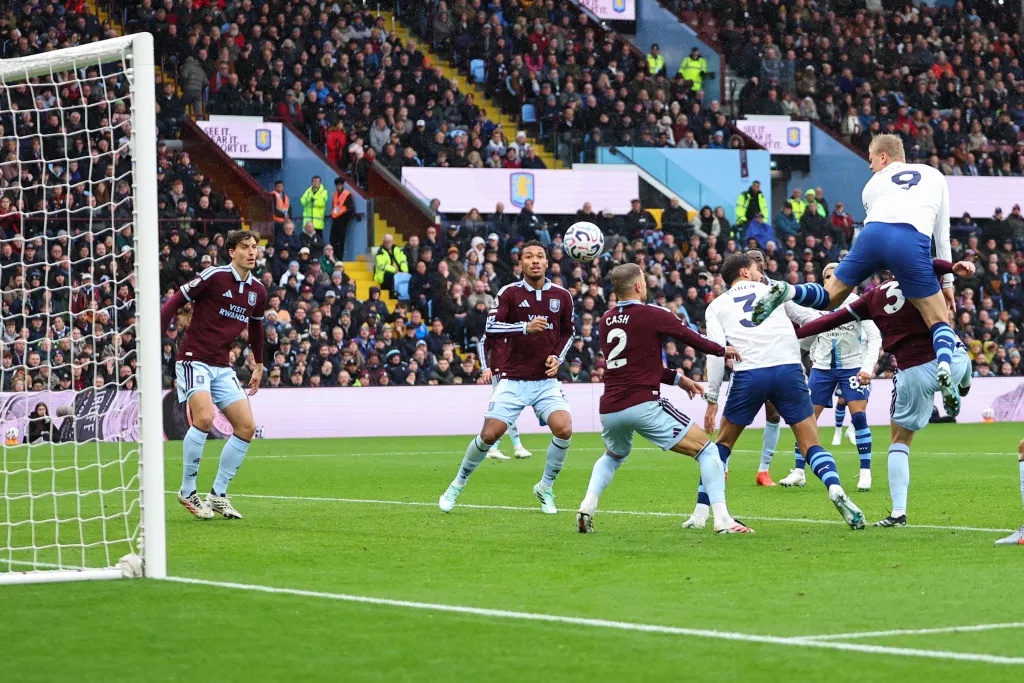 Erling Haaland of Manchester City scores a goal against Aston Villa.