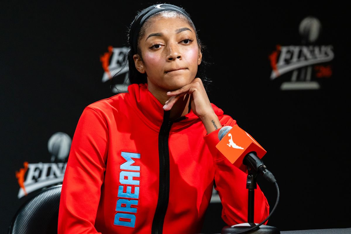 Angel Reese speaks to the media