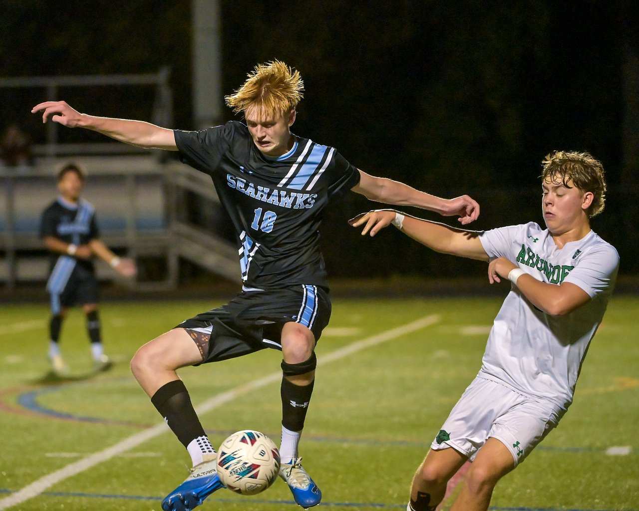 South River Seahawks Gavin Curtis #18 gets control of the ball with his feet in front of Arundel Wildcats Evan Estes #6 during the first half. The visiting Arundel Wildcats defeat the South River Seahawks, 2-1, in overtime in an MPSSAA Class 3A East II quarterfinal boys soccer game Wednesday evening. (Paul W. Gillespie/Staff)