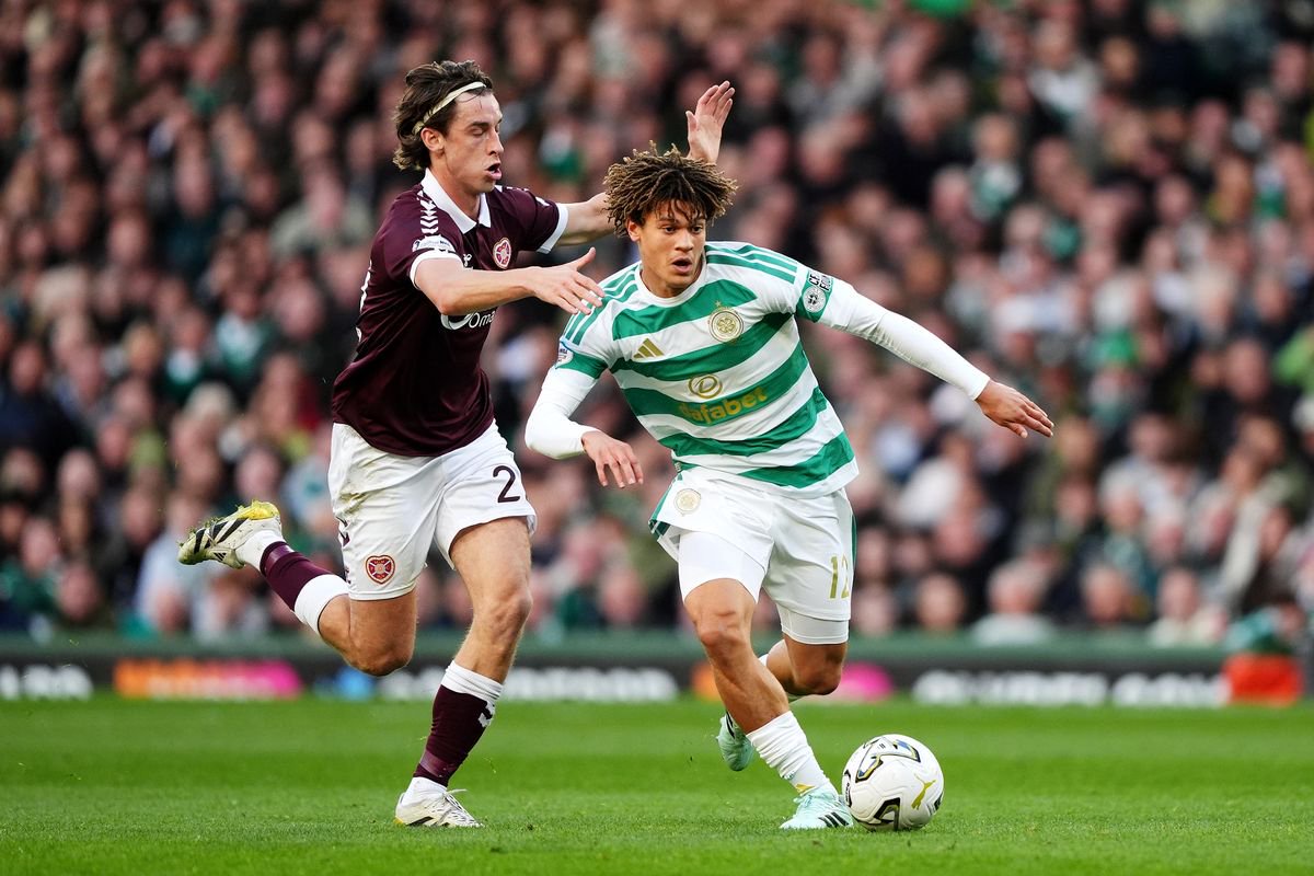 Celtic's Landon Emenalo and Heart of Midlothian's Tomas Bent Magnusson battle for the ball during the William Hill Premiership match at Celtic Park, Glasgow.