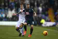 Stephen Warnock of Leeds battles with Johnny Russell of Derby County during the Sky Bet Championship match between Leeds United and Derby County at...