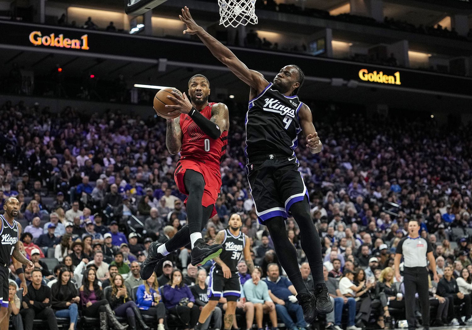 Damian Lillard #0 of the Portland Trail Blazers and Precious Achiuwa #9 of the Sacramento Kings. (Thearon W. Henderson / Getty)