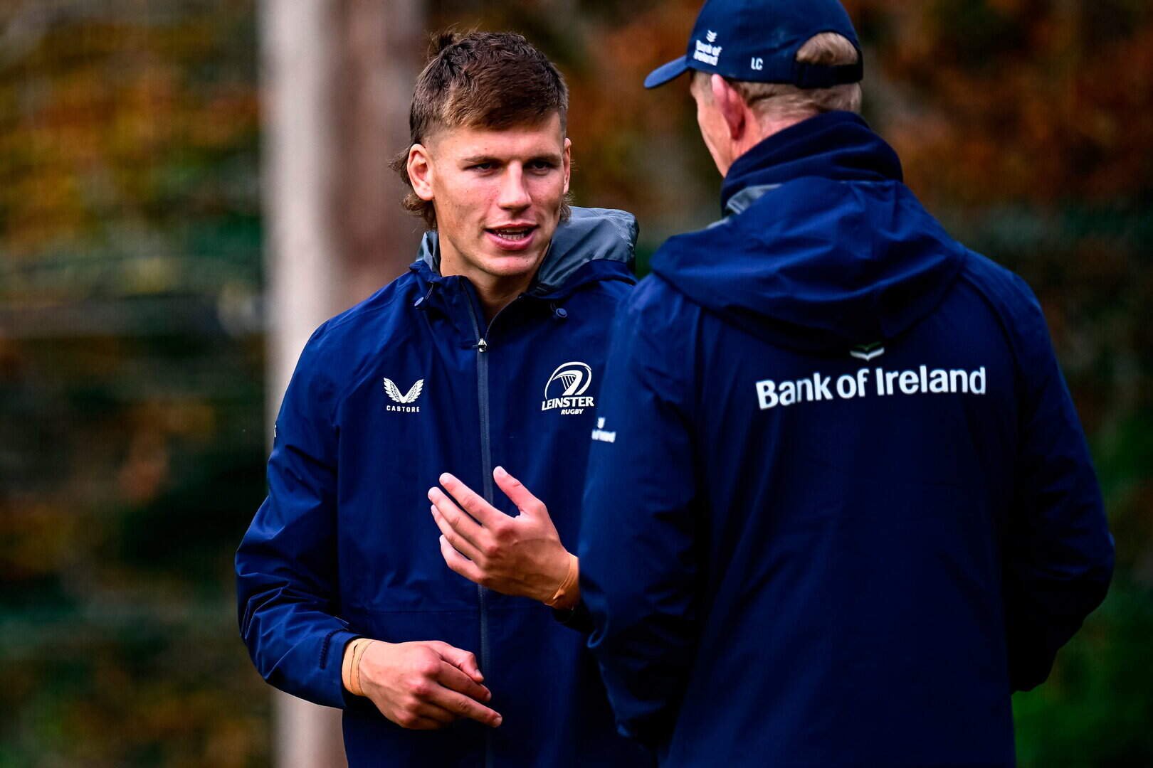 Sam Prendergast, left, with head coach Leo Cullen during a Leinster training session at UCD in Belfield, Dublin