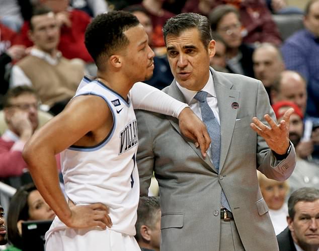 FILE - Villanova's Jalen Brunson, left, leans on coach Jay Wright during a timeout during the second half of an NCAA men's college basketball tournament first-round game against Radford, Thursday, March 15, 2018, in Pittsburgh. (AP Photo/Keith Srakocic)