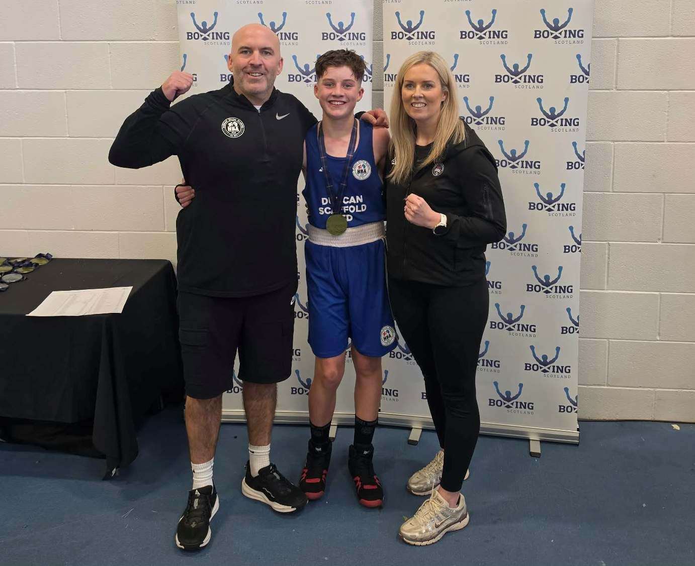 Robbie Foy, flanked by mum and dad Ashley and Liam, who have both been involved with Highland Boxing Academy since the beginning.