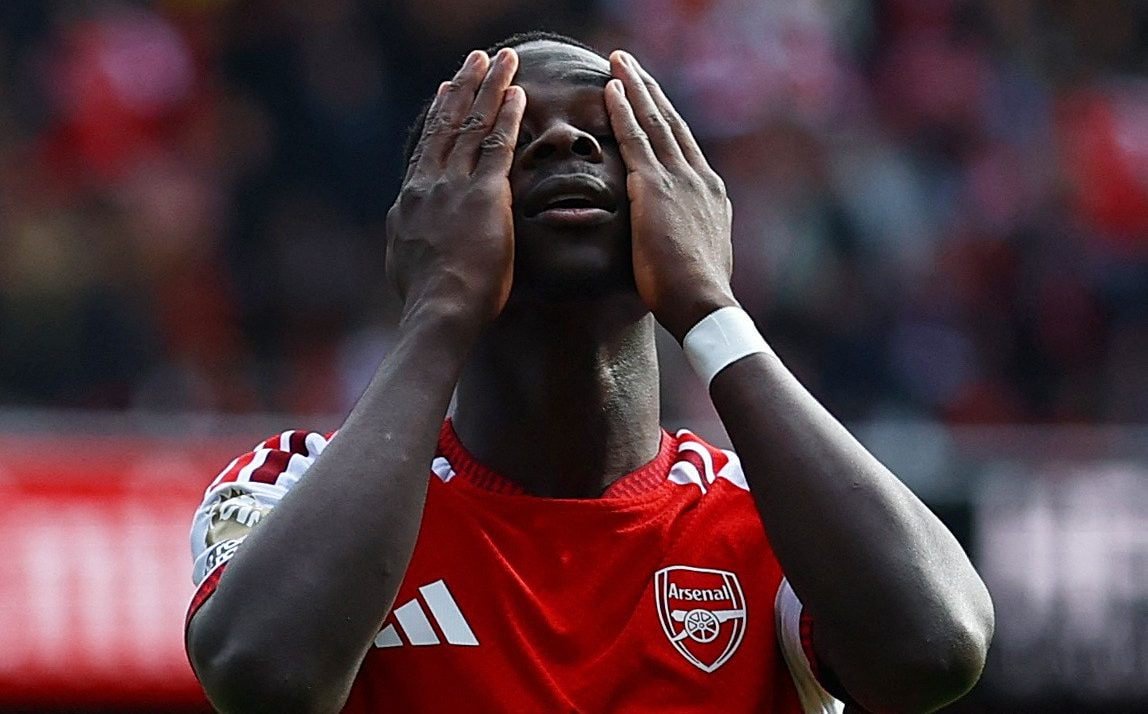 Saka reacts after a missed chance
