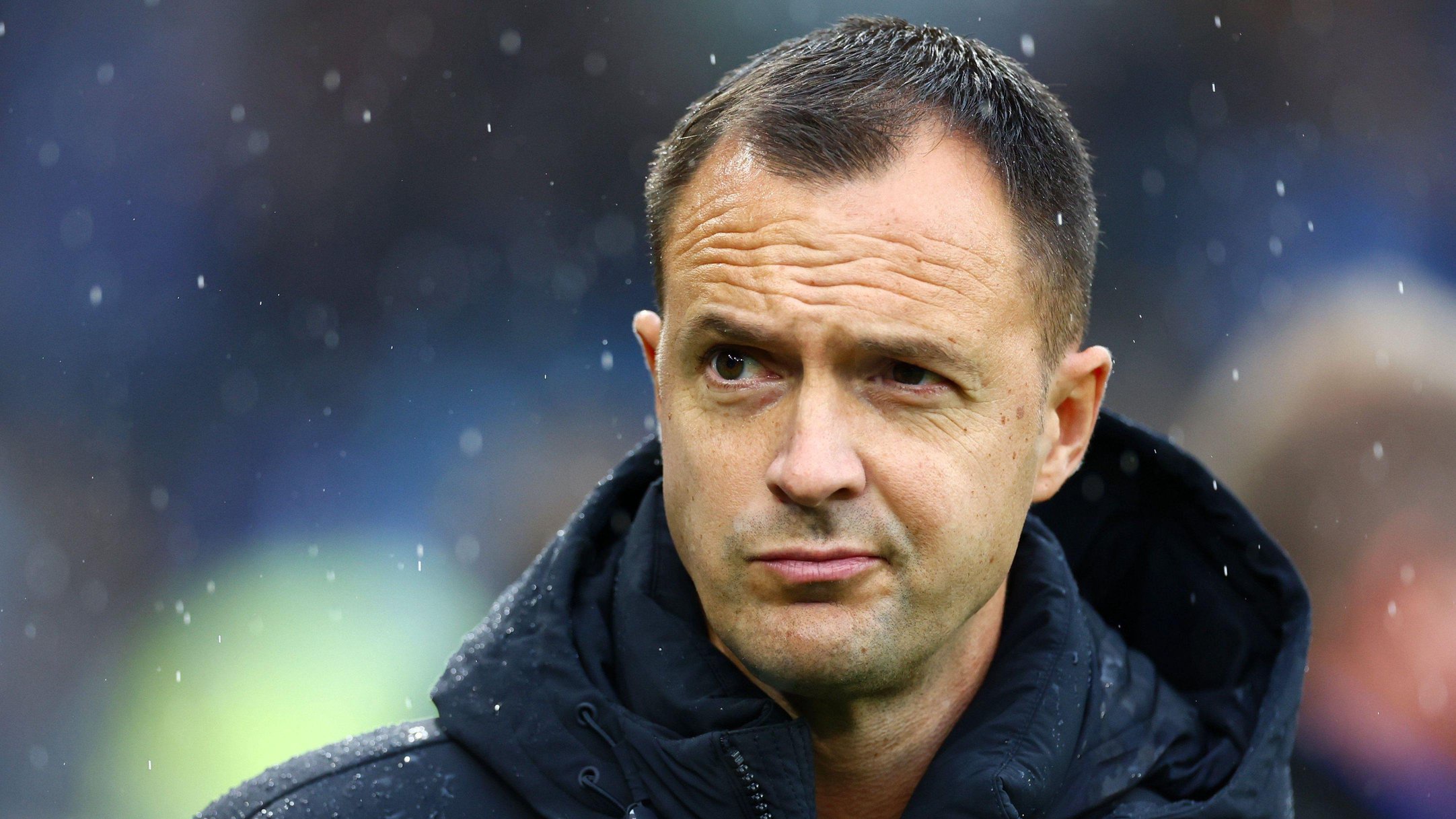 Birmingham City boss Chris Davies watches his side lose for the first time in six games in the Cardiff rain