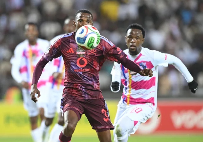 Sbangani Zulu of Orlando Pirates challenges Menzi Chili of Milford FC  during the Carling Knockout Cup Last 16 match that went 3-0 to the home side at Orlando Amstel Arena. 