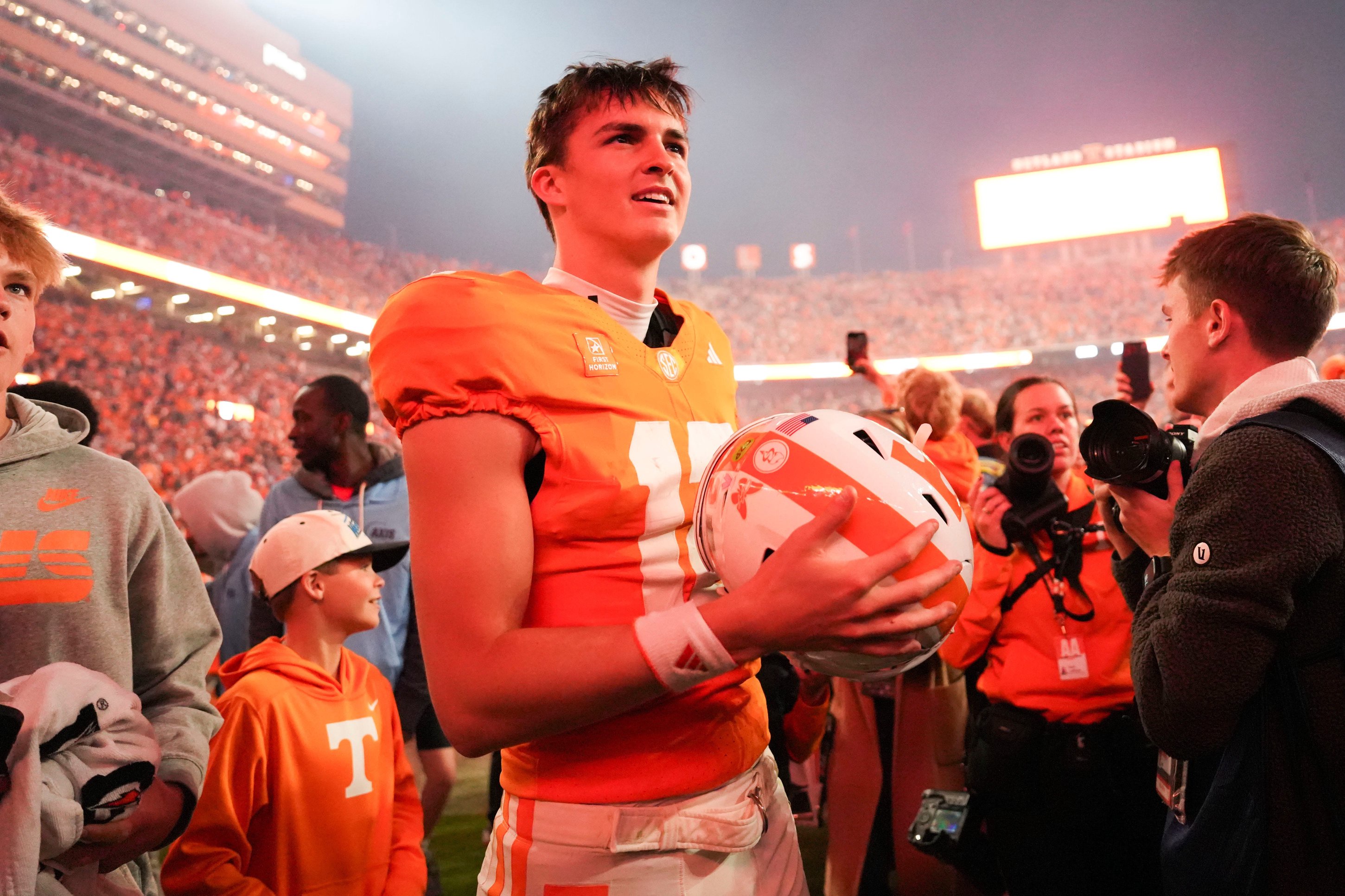 Cigar smoke floats in the air as Tennessee quarterback George MacIntyre (12) celebrates after a game between Tennessee and Alabama in Neyland Stadium in Knoxville, Tenn., Oct. 17, 2026.