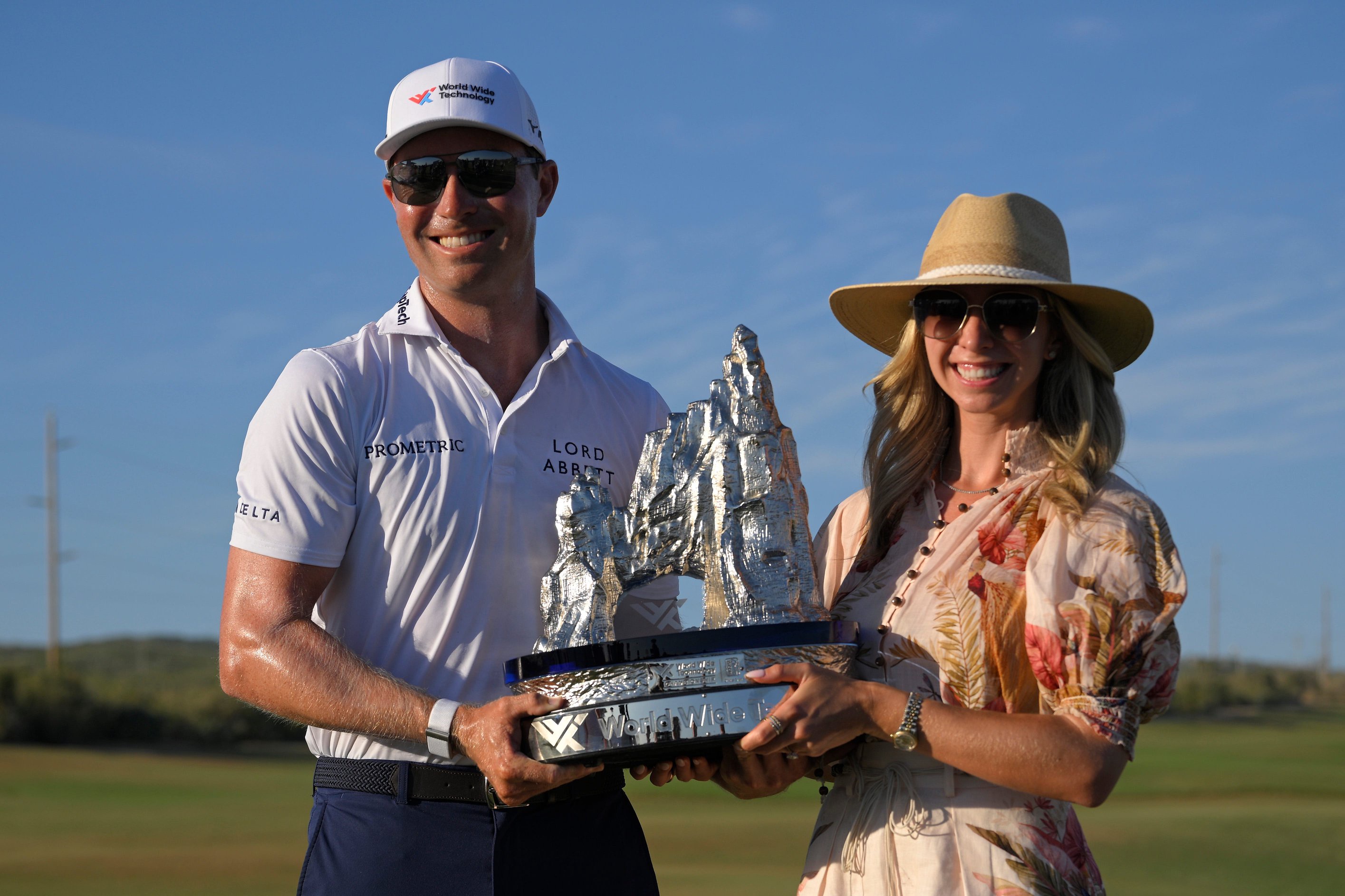 Ben Griffin of the United States poses with his fiancee, Dana Myeroff and the championship trophy after the final round of the World Wide Technology Championship 2025 at El Cardonal at Diamante on November 09, 2025 in Cabo San Lucas, Mexico.
