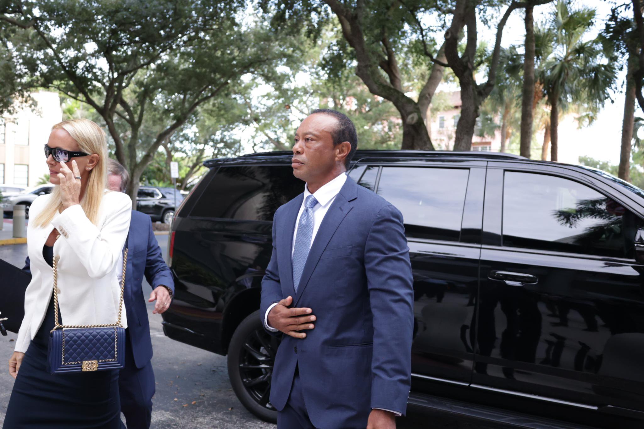 Tiger Woods arrives at court with Vanessa Trump.