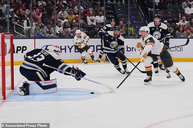 Vegas Golden Knights center Jack Eichel (9) attempts a shot as Columbus Blue Jackets goaltender Cam Talbot (33) defends during the first period of an NHL hockey game Saturday, Oct. 24, 2026, in Columbus, Ohio. (AP Photo/Joshua A. Bickel)