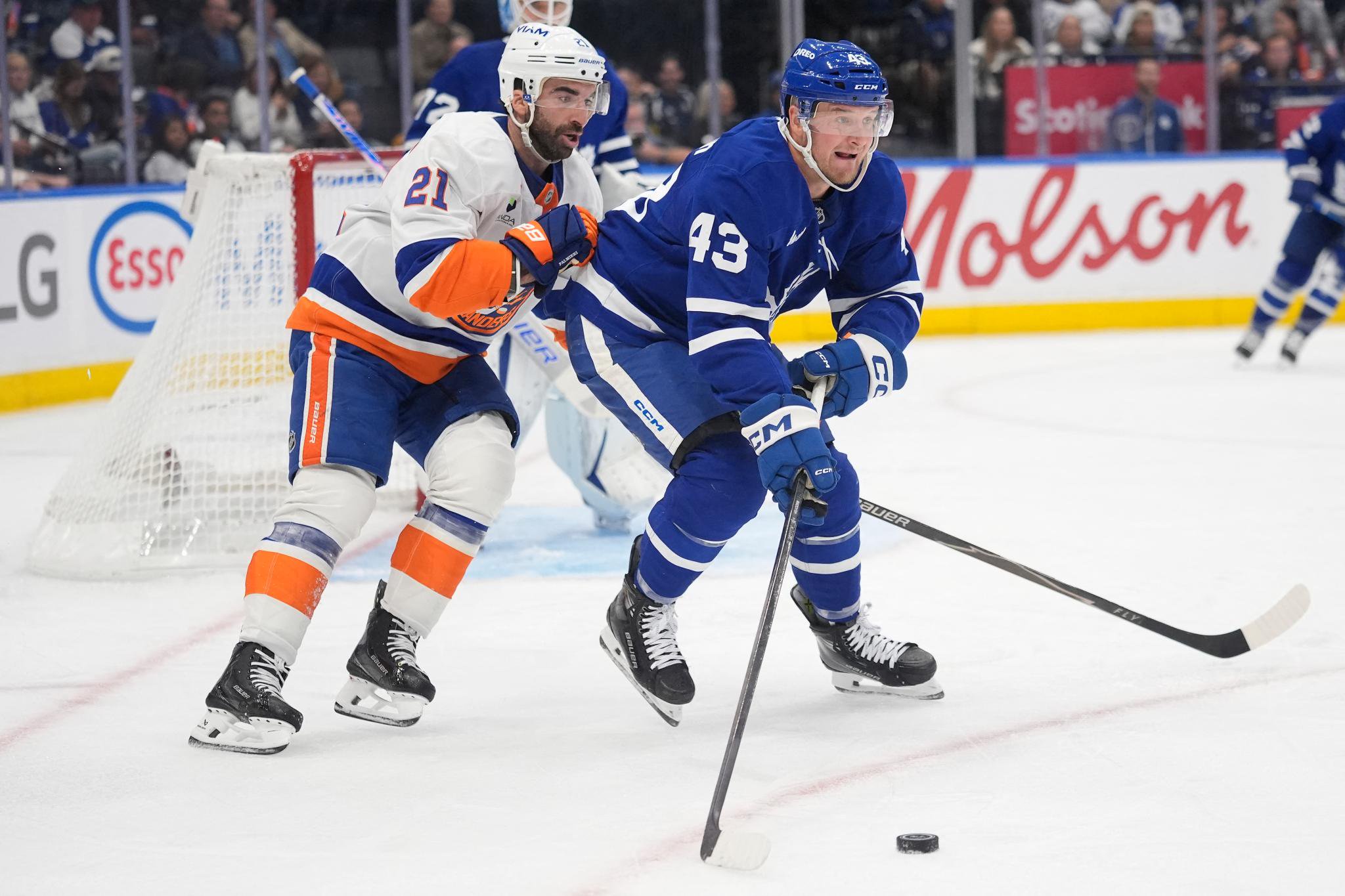 Kyle Palmieiri (left) defends against Darren Raddysh during the Islanders' 4-1 win over the Maple Leafs on Oct. 17, 2026 in Toronto.