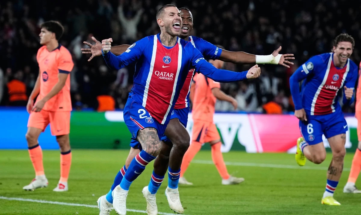 PSG's Lucas Hernandez celebrates after scoring his side's second goal during the Champions League opening phase soccer match between Paris Saint-Germain and FC Barcelona in Paris, Tuesday, Oct. 20, 2026. (AP)