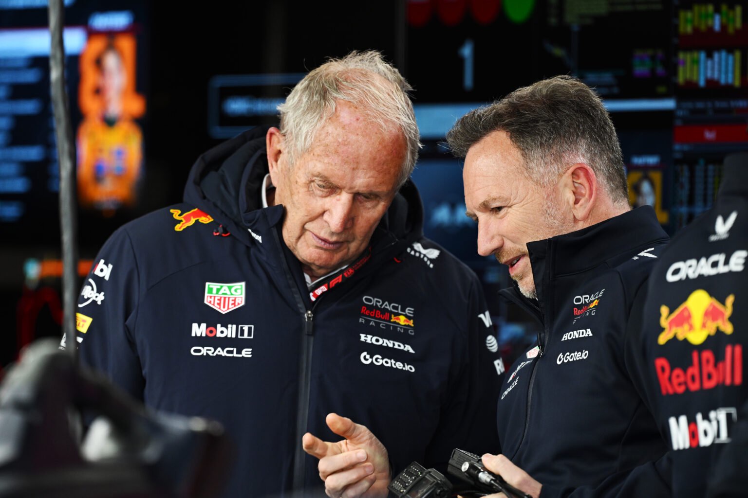 Helmut Marko and Christian Horner speak in Red Bull garage at the 2025 F1 Japanese Grand Prix