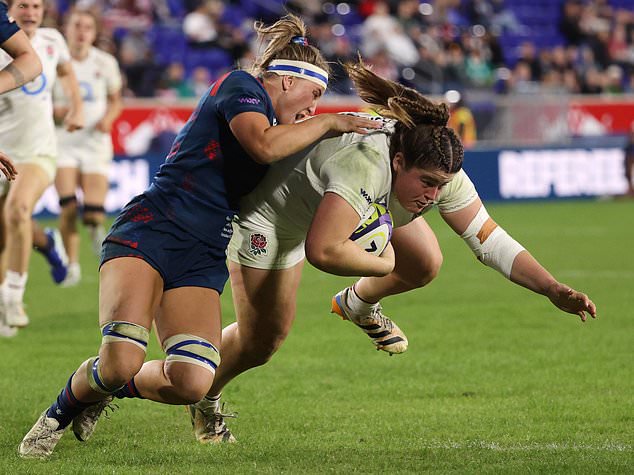 United States' Georgie Perris-Redding, left, tackles England's Maud Muir, right, during the second half of an international women's rugby match during the WXV Global Series, Friday, Oct. 30, 2026, in Harrison, N.J. (AP Photo/Pamela Smith)