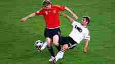 Thomas Hitzlsperger challenges Spain's Fernando Torres during the final of Euro 2008