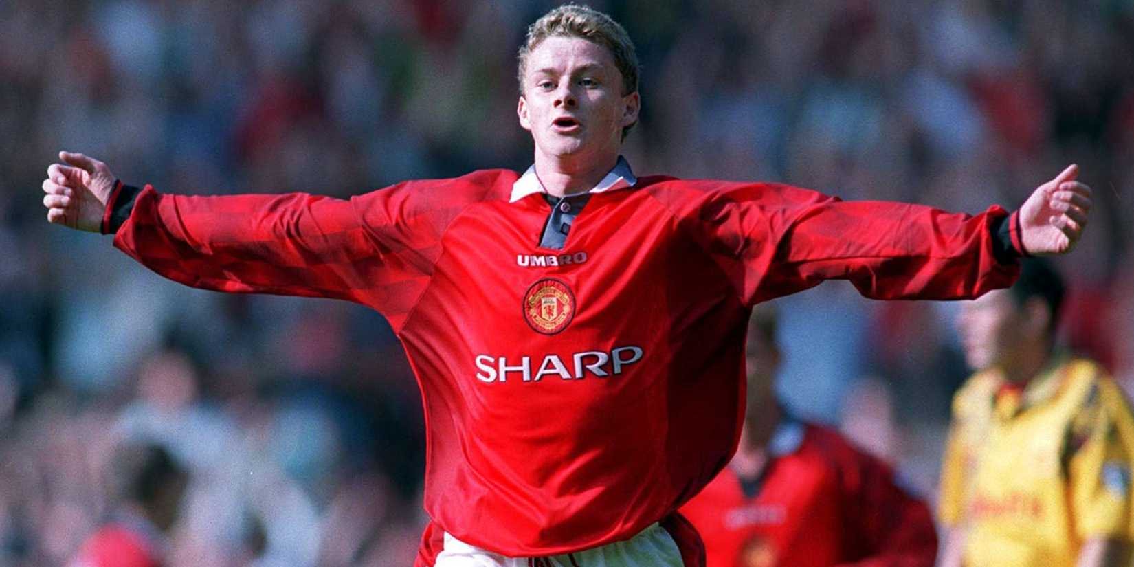Ole Gunnar Solskjaer celebrates with outstretched arms after scoring for Manchester United.