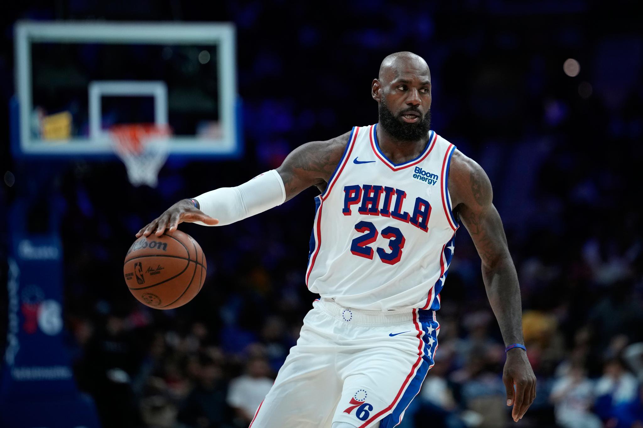 Philadelphia 76ers' LeBron James dribbles the ball during a game.