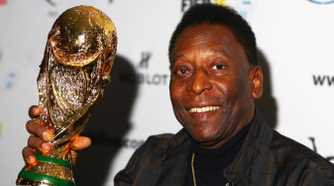Pele lifting the World Cup trophy.