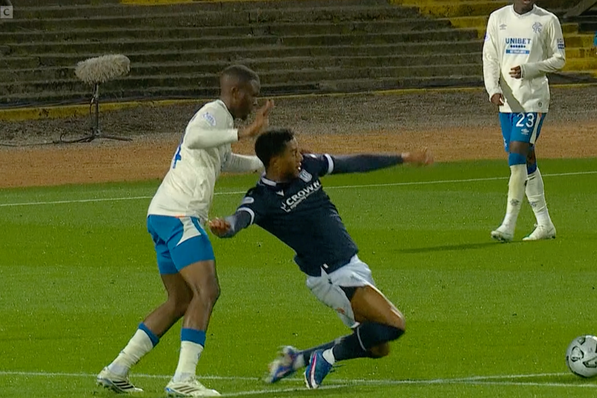 Dundee's Joe Bevan goes down under Rangers pressure