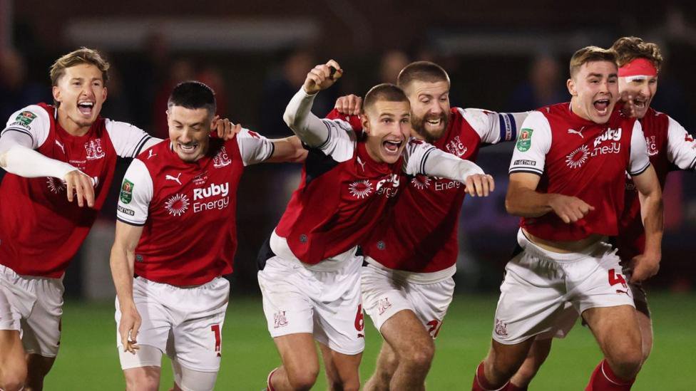 Fleetwood players run away in celebration