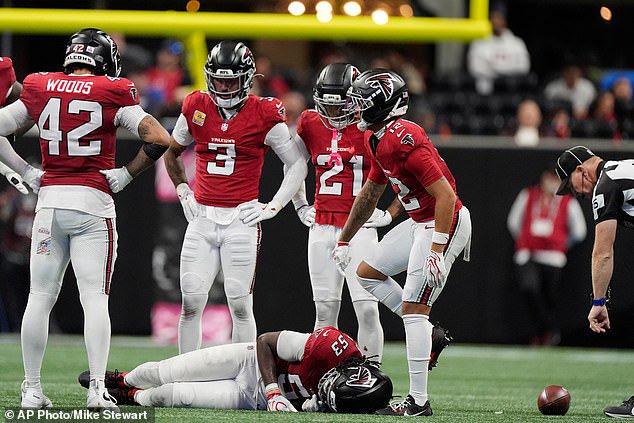 Atlanta Falcons linebacker Kendal Daniels (53) lies motionless on the field on Sunday