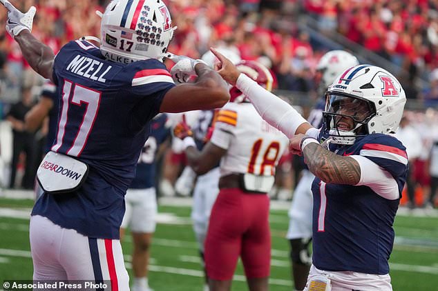 Arizona's Isaiah Mizell (17) celebrates with quarterback Noah Fifita (1) after scoring a touchdown against Iowa State during the first half of an NCAA college football game Saturday, Oct. 24, 2026, in Tucson, Ariz. (AP Photo/Darryl Webb)