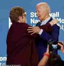 Biden embraces pop icon Elton John at an event on Friday night as he tries to move on from his disastrous debate performance a night before
