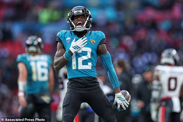 Jacksonville Jaguars wide receiver Travis Hunter (12) reacts after making yards during an NFL football game in London, Sunday, Oct. 18, 2026. (AP Photo/Ian Walton)