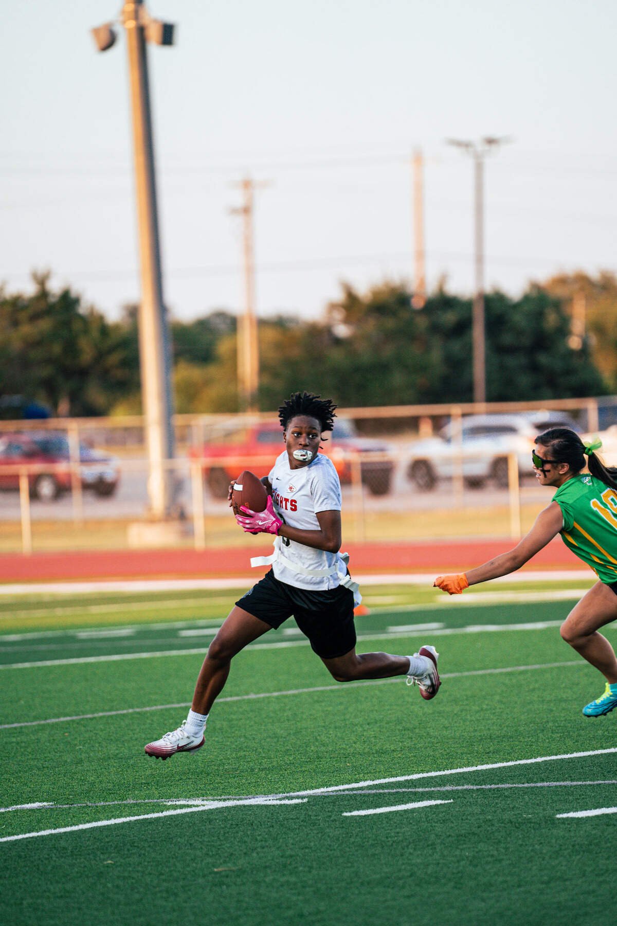 Wichita Heights standout Destiny Maze, an All-Metro basketball selection, competes in flag football during the inaugural night of the KSHSAA-sanctioned sport.