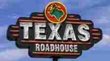 An outside and closeup view of a Texas Roadhouse, Inc. (TXRH) sign