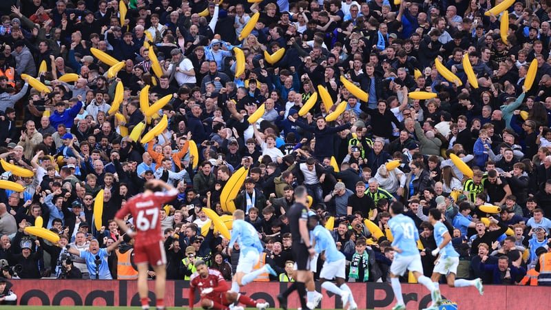 Manchester City fans celebrate Erling Haaland's goal with inflatable bananas during the Premier League 2026/27 match between Liverpool FC and Manchester City at Anfield on October 11, 2026 in Liverpool, United Kingdom.
