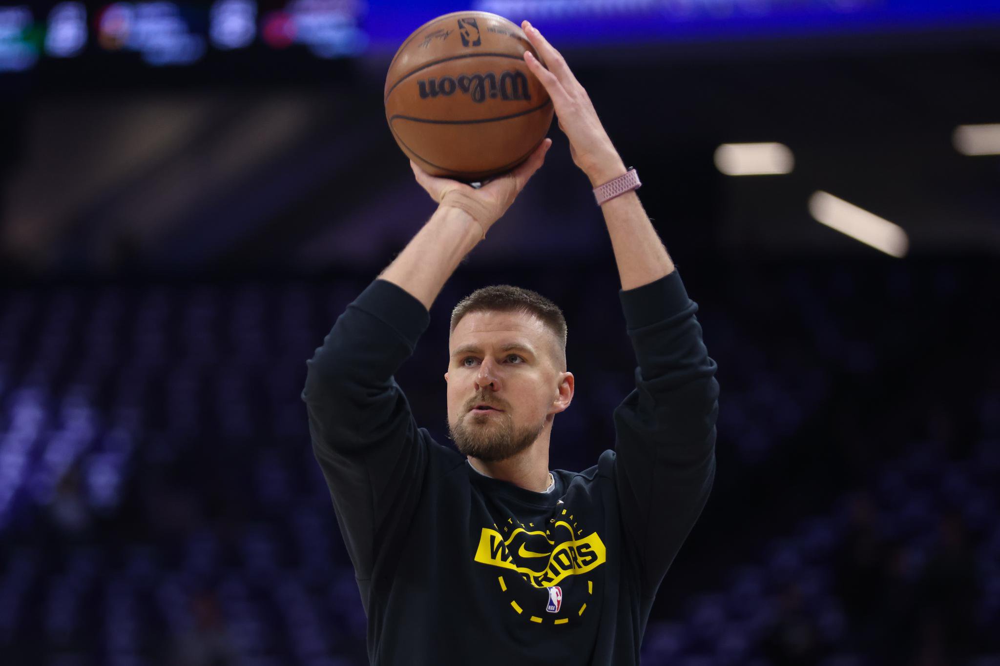 Golden State Warriors center Kristaps Porzingis warms up before an NBA basketball game