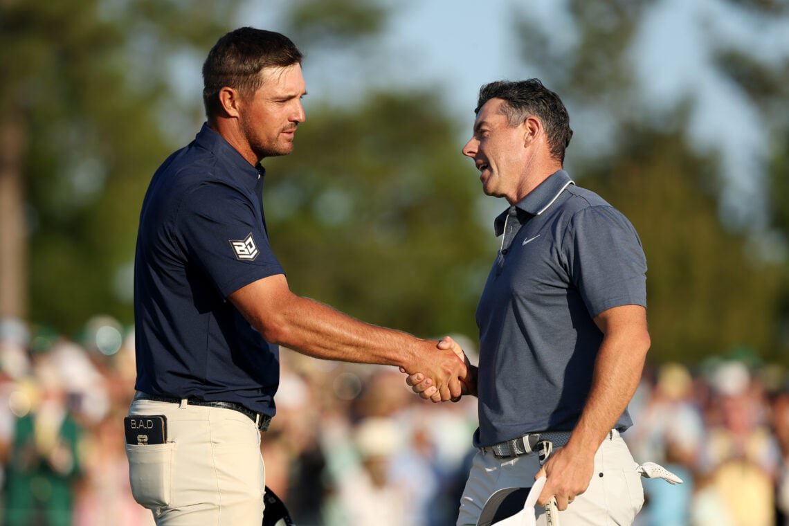 Rory McIlroy of Northern Ireland shakes hands with Bryson DeChambeau of the United States on the 18th hole during the final round of the 2025 Masters